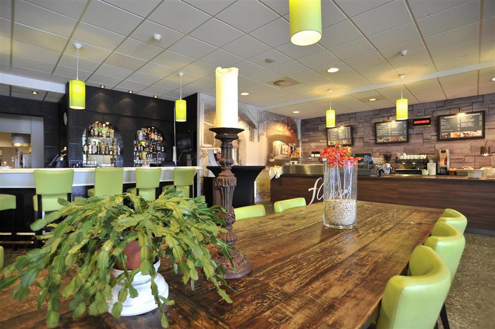 Tulip Inn لايدردورب المطعم الصورة