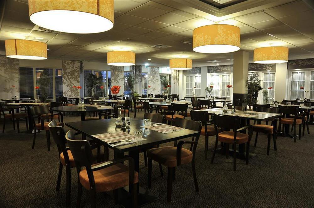 Tulip Inn لايدردورب المطعم الصورة